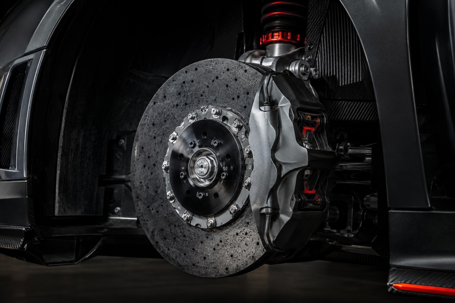 Carbon ceramic brake rotor, caliper and suspension components